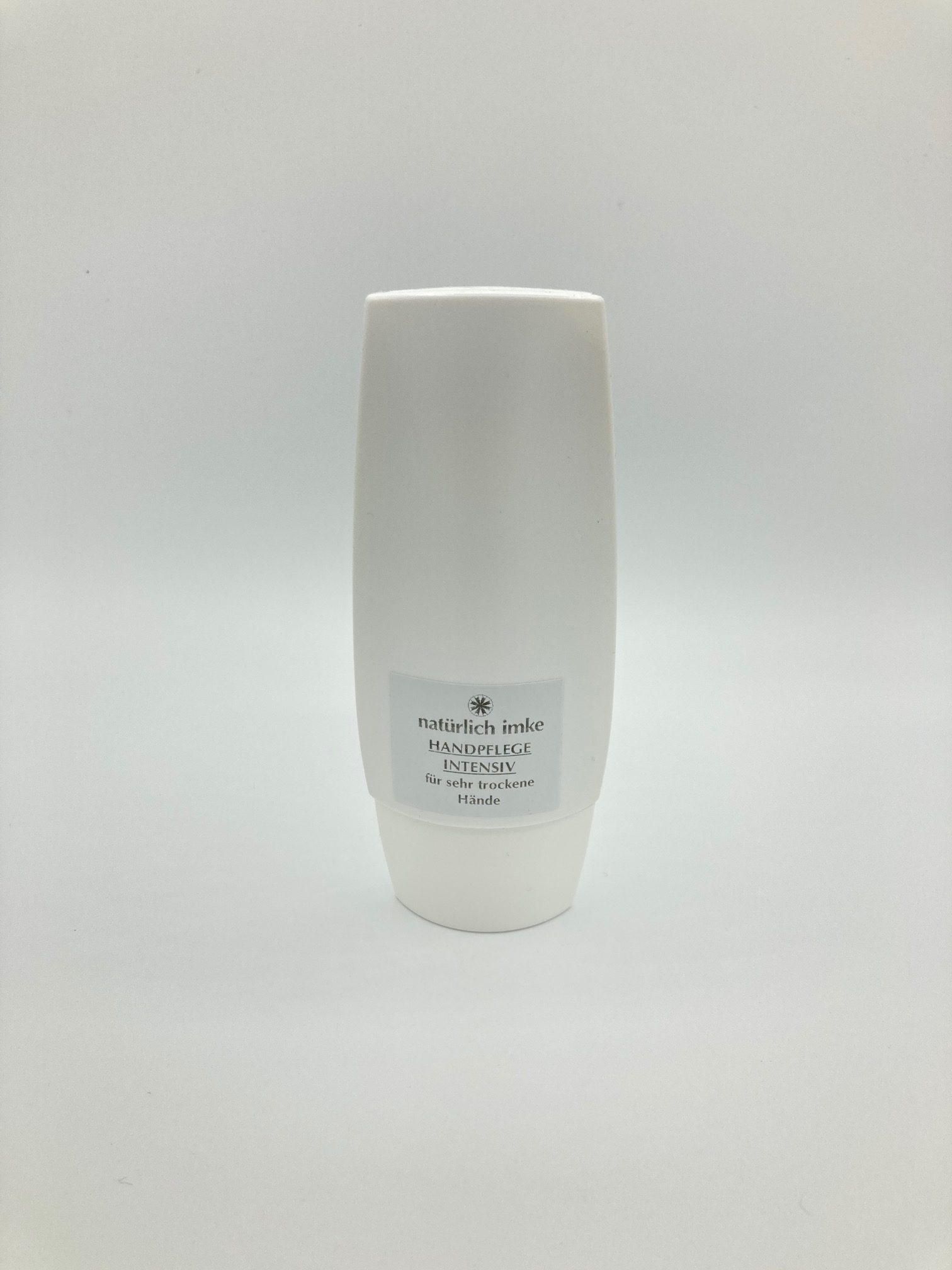 Die weiße flache 50ml-Polypropylen-Tube enthält eine wollweiße Creme